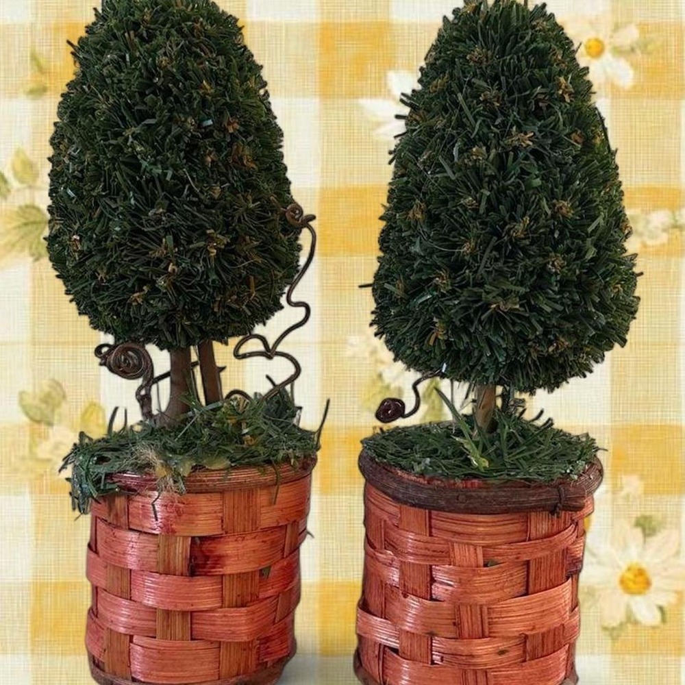 Green topiary trees with brown baskets